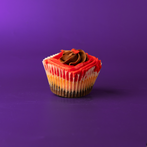 A brownie base topped with a strawberry cupcake, topped with chocolate buttercream and red colored strawberry cream cheese icing and finished with one red heart sprinkle...especially for your love! 1st Kiss cupcake