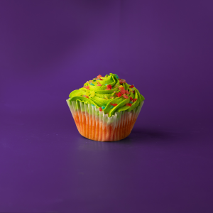 A Jolly Rancher cupcake with a Jolly Rancher cream cheese icing and sprinkled with chopped jolly ranchers. Jolly Rancher
