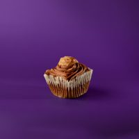 A German chocolate cupcake with German chocolate filling topped with chocolate buttercream and finished with a dollop of the German chocolate filling. German Chocolate cupcake