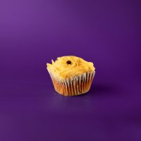 A caramel cupcake filled with espresso ganache, topped with caramel buttercream, caramel drizzle, sea salt, and one coffee bean. Salted Carmel Macchiato cupcake