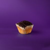 A triple berry poundcake cupcake topped with a triple berry glaze. Triple Berry Pound Cake cupcake