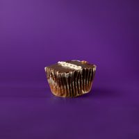 A chocolate cupcake with marshmallow filling, topped with chocolate ganache icing and finished with a white vanilla buttercream swirl. Hostess with the Mostest cupcake