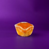 A peach poundcake cupcake topped with a peach glaze. Peach Poundcake cupcake