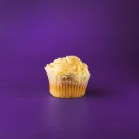 An eggnog cupcake with an eggnog ganache filling, topped with eggnog cream cheese icing, drizzled with eggnog and finished with a sprinkle of nutmeg. Eggnog cupcake