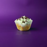 A mint cupcake with chocolate chips, topped with green mint cream cheese icing and finished with mini chocolate chips. Mint Chocolate Chip cupcake